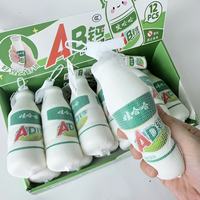 Wahaha AD Jouet à presser pour le lait de calcium Gadget anti-stress à rebond lent Ensemble de 12 pièces mignon et câlin Sac en maille en PU