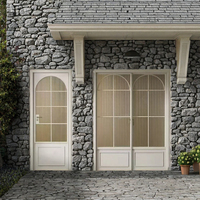 Porte d'entrée moderne en alliage d'aluminium avec panneaux de verre divisés, isolation thermique, design en arche pointue pour usage extérieur de villas et d'hôtels