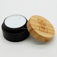 Pot à crème 30g 50g 100g en verre noir mat avec couvercle en bois pour les soins de la peau du visage, du corps et des yeux