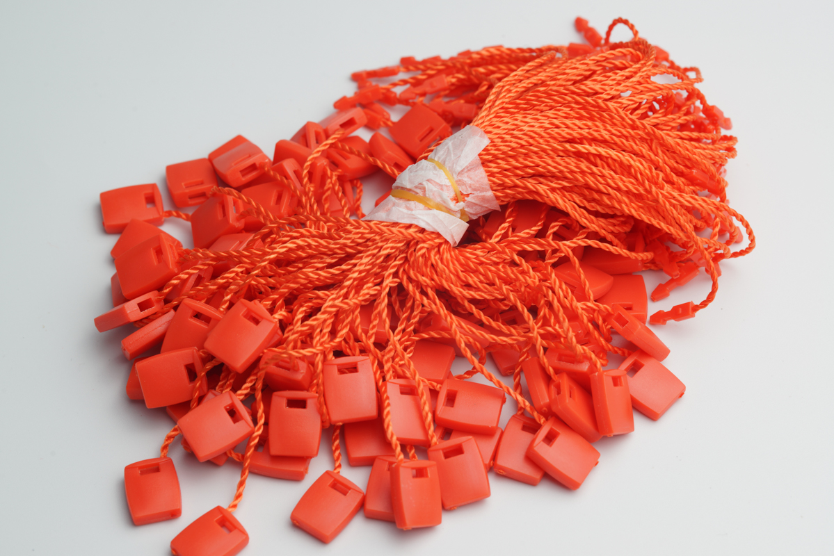 Cheap price in stock nylon plastic garment clothing seal cord loop lock price hangtag fastener hang tag with string for clothes