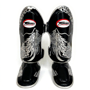 Protège-tibias de boxe en cuir professionnels Twins, protection renforcée, respirants, durables, fermeture auto-agrippante - Product Image 1