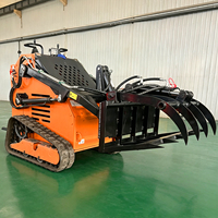 Mini-chargeuse compacte hydraulique avec grappin à racines et grappin à bûches pour le déblaiement des déchets de jardin et du bois de chauffage