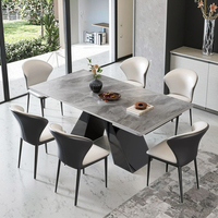 Table à manger moderne de luxe avec plateau en pierre frittée grise et base en métal géométrique pour mobilier de villa haut de gamme