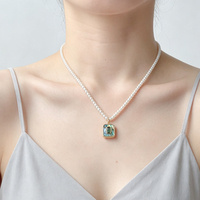 Collier de perles vintage noir et blanc avec pendentif spirale en émail et nacre, élégante chaîne de clavicule pour femme, bijoux de mode