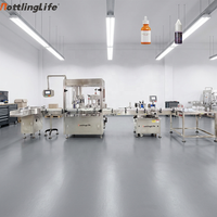 Machine de remplissage entièrement automatique pour flacons de liquides oraux et de sirops