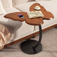 Table basse d'appoint en bois style moderne et épuré, avec motifs papillon, dotée de fonctionnalités combinées portables et décoratives pour la maison, le salon et la chambre.
