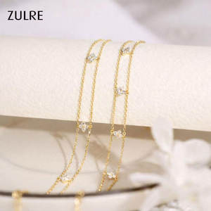 سوار نسائي عصري بتصميم أوراق البرسيم رباعية الأزهار، مرصع بالمويسانيت 2.5 ملم، بسلسلة مزدوجة على شكل زهور، سوار جذاب يجلب الحظ. - Product Image 1