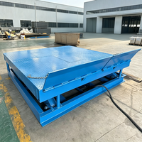 Plateforme élévatrice à ciseaux électrique stationnaire hydraulique pour la manutention de marchandises en entrepôt et l'optimisation logistique