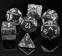 Dés polyédriques noirs mouchetés d'étoile de résine avec la numérotation blanche pour des jeux de rôle de table