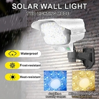 Caméra de surveillance de simulation Lampe murale à induction solaire LED Lumière forte Lampe de rue anti-voleur Télécommande Lampe de surveillance