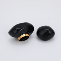 Forma única Tapa de perfume negra Forma de piedra Tapa de botella de perfume ABS de lujo