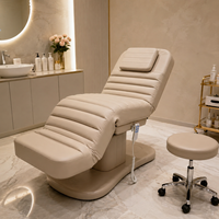Lit de beauté facial moderne en PVC avec mécanisme de levage électrique, 3 moteurs, design pliable pour usage en salon