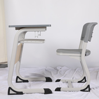 Ensemble de mobilier scolaire ergonomique moderne avec chaise et bureau de classe en MDF, structure métallique de 1,5 mm, durable, pour université et chambre.