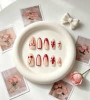 Faux ongles en ABS, forme amande, rouge nude, motif fleur, avec nœud rouge jazzant et cerise, 30 pièces en boîte, vente en gros, pour usage quotidien et fêtes