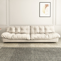 Canapé Cloud, style italien minimaliste, tissu technique givré, rembourrage en duvet, pour petit appartement ou salon.