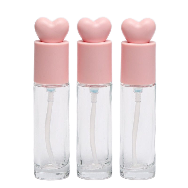 Luxury 30ml Refillable Glass Foundation Bottle with Pink Heart Cap and Press Mechanism for Cosmetic Packaging