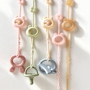 Attache-sucette en silicone Doublecare avec perles en bois, anti-chute, multifonctionnelle pour sucette, anneau de dentition et biberon - Product Image 1