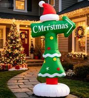 Panneau directionnel de Noël gonflable avec logo, flèche rouge et verte indiquant l'atelier du Père Noël pour la signalisation des centres commerciaux et des événements