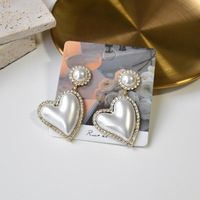 Boucles d'oreilles pendantes exagérées pour femmes, polyvalentes, haut de gamme, accessoires d'oreille élégants
