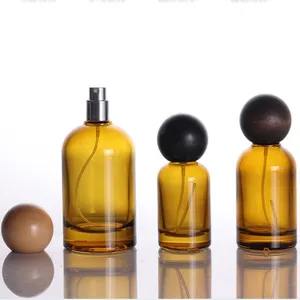 New Luxury Cylinder Shape Amber Spray Glass Bottle 30ml 50ml 100ml Perfume Bottle With Round Wooden Lids