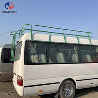 Vente d'autobus Coaster d'occasion (16-30 places) fiables, fabriqués en usine, pour le transport de passagers en Afrique, équipés d'un porte-bagages de toit