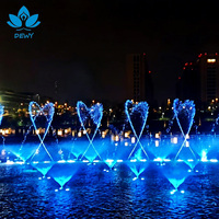 Fontaine musicale extérieure moderne en acier inoxydable contrôlée par DMX, avec lumières et jets d'eau dansants pour terrasse et sol