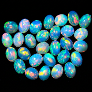 Lot de pierres précieuses opale éthiopienne de qualité AAA+ 6x8 mm / 0,85 carats, forme ovale, opale multi-feu, opale authentique, opale calibrée Welo Fire. - Product Image 1