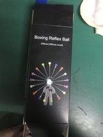 Balle de boxe réflexe avec bandeau en silicone réglable et logo personnalisé, dotée d'un anneau rotatif à 360 degrés