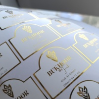 Autocollant adhésif personnalisé imprimé découpé à l'emporte-pièce or estampage à chaud film vinyle PET étanche Transparent étiquette en relief pour bouteilles