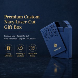 Boîte cadeau personnalisée bleu marine <span class=keywords><strong>d</strong></span>écoupée au laser avec manchon en filigrane de feuilles, fermeture à languette avec icône en feuille <span class=keywords><strong>d</strong></span>'or, emballage cadeau de luxe mat doux au toucher - Product Image 1