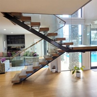 Escalier intérieur flottant moderne en U avec marches en bois massif, garde-corps en verre, monopoutre, forme et taille personnalisées