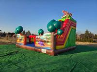 Château gonflable commercial sur le thème de la ferme avec toboggan pour parc d'attractions