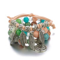 Prix d'usine Charme Bohème Ensemble de bijoux bracelets à perles de verre superposées, bracelets à pendentif feuille uniques de créateur, pour couple 2026