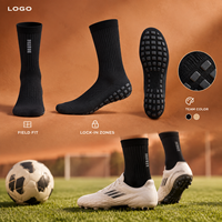 Chaussettes de football renforcées noires mi-mollet avec coussinets internes et externes pour une adhérence optimale sur le terrain, profil mince, adaptées aux crampons, avec tableau de tailles