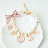 Collier en ruban luxueux et mignon pour chats et chiens, motif de dessin animé, clochette intégrée, confortable à porter, accessoire haut de gamme