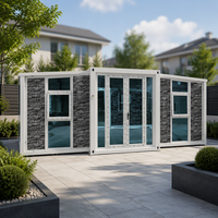 Maison conteneur extensible moderne avec portes vitrées de luxe et extérieur en pierre personnalisé pour usage résidentiel