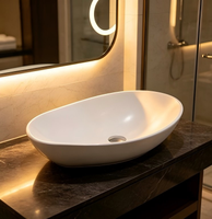 Lavabo rond design moderne en porcelaine artistique pour salle de bain d'hôtel