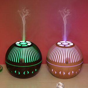 Diffuseur d'huiles essentielles et <span class=keywords><strong>humidificateur</strong></span> d'air miniature en bois grainé, nouveau style - Product Image 1