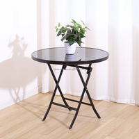 Petite table ronde noire simple à la mode Table pliante en verre pour balcon extérieur