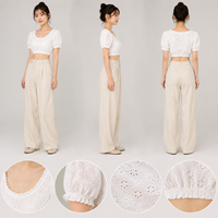 Ensemble deux pièces pour femmes, haut court à manches bouffantes à œillets blancs et pantalon large à taille haute, tenue d'été