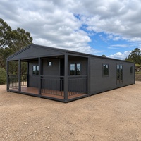 Maison pliable extensible gris foncé avec véranda, idéale pour le glamping en extérieur, le bureau ou l'hébergement temporaire