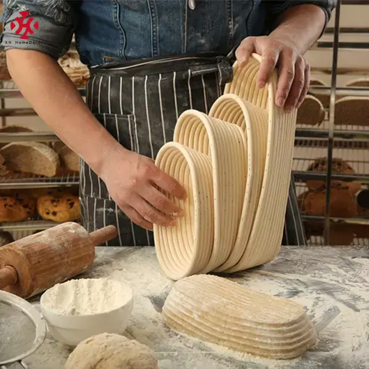 XH fabbrica all'ingrosso personalizzato 10 pollici ovale rattan resina vimini cestino per la lievitazione del pane intrecciato a mano strumento di cottura cestini regalo alla rinfusa