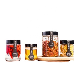 Wholesale Food Grade Empty Round Transparent Mini <b>Jam</b> Honey Glass <b>Jar</b> Small Glass <b>Jars</b> With Black Metal Lid - Product Image 2