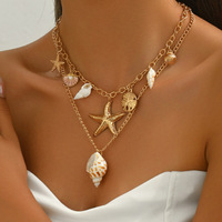 Collier pour femme en or 14 carats, style bohème, multi-couches, avec pendentifs étoile de mer, coquillage, conque et perles d'imitation, chaîne de clavicule haut de gamme