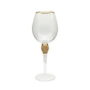 Crystal wine glasses with diamond decoration and gold rim for wedding