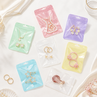 100 pièces/sac Sachets holographiques en Mylar à fermeture éclair pour bijoux, poudres, aliments secs, noix, bonbons, emballage irisé