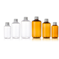 Bouteille de voyage ronde en PET marron transparent de 300 ml avec bouchon à pression pour lotion/shampoing/gel douche/savon liquide
