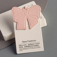 Etiquetas de precio de papel con forma de lazo rosa personalizadas al por mayor para ropa, etiquetas impermeables para ropa de moda, código de barras para zapatos Boutique