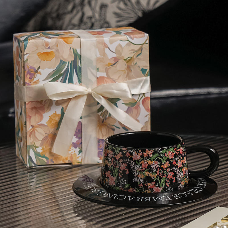 Black cups and saucers - lily-shaped box with ribbon