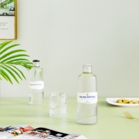 Nouvelle bouteille en verre transparente/verte 350/500/750 ml pour eau gazeuse, bouteille en verre tendance pour le stockage de jus de fruits avec couvercle à couronne métallique